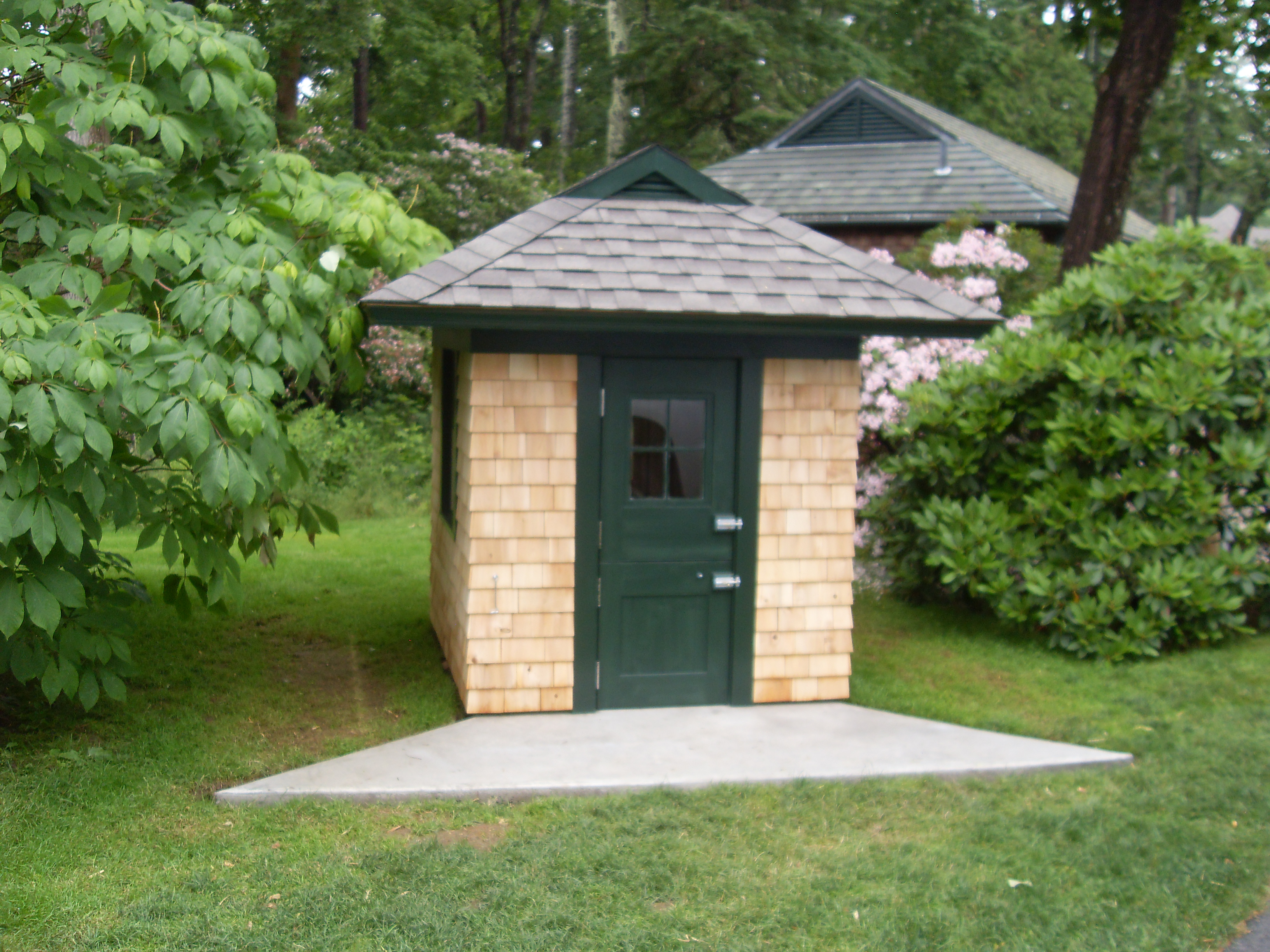 Dog house with roof built to match guest house